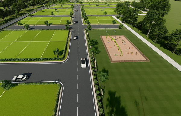 Aerial view of plotted development with wide internal roads, green landscaped plots, and open spaces in a residential layout.