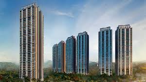 Modern high-rise residential apartment towers in Gurugram featuring contemporary architecture, multiple towers, landscaped surroundings, and a well-planned gated community.