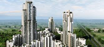 Aerial view of Ireo Victory Valley in Sector 67, Gurugram featuring iconic high-rise towers, landscaped surroundings, open green spaces, and a premium residential township.