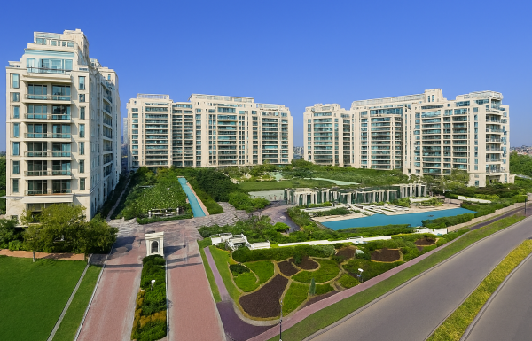 Aerial view of DLF The Magnolias on Golf Course Road, Gurugram showcasing ultra-luxury high-rise towers, landscaped gardens, internal roads, and premium residential surroundings.